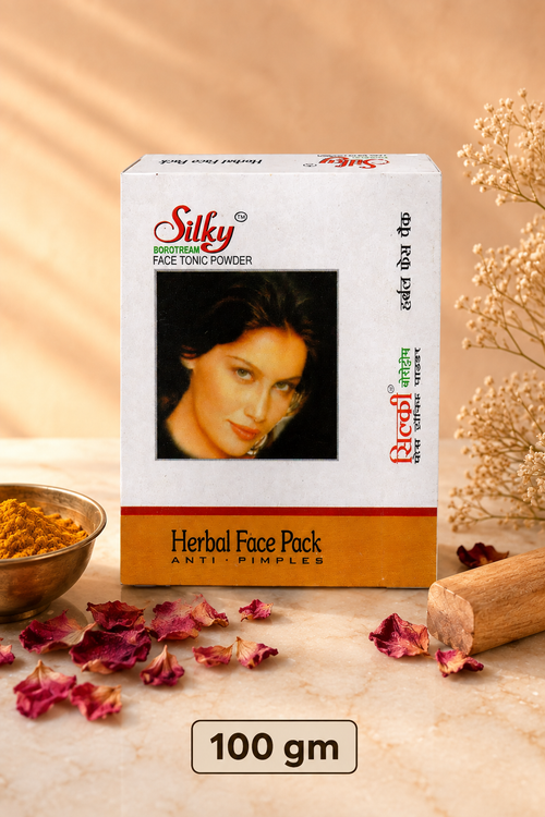 Gopal Silky Face Tonic Powder 100 gm box with turmeric, rose petals and sandalwood on warm marble