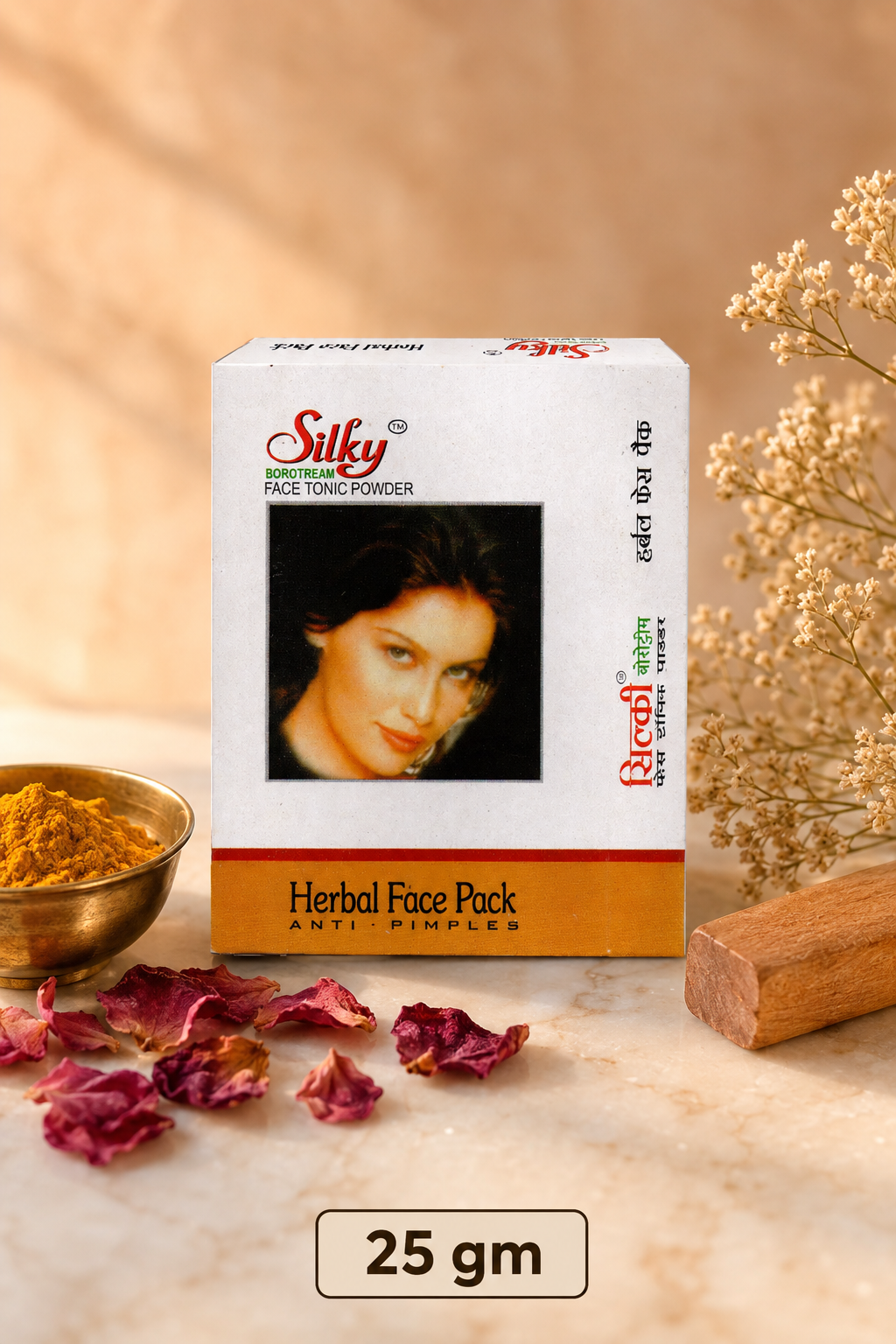 Gopal Silky Face Tonic Powder 25 gm box with turmeric, rose petals and sandalwood on warm marble